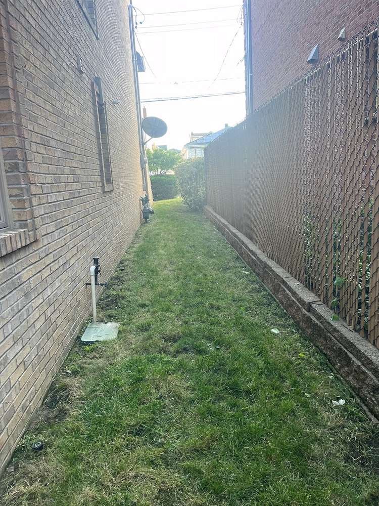 Clean, mowed side yard path